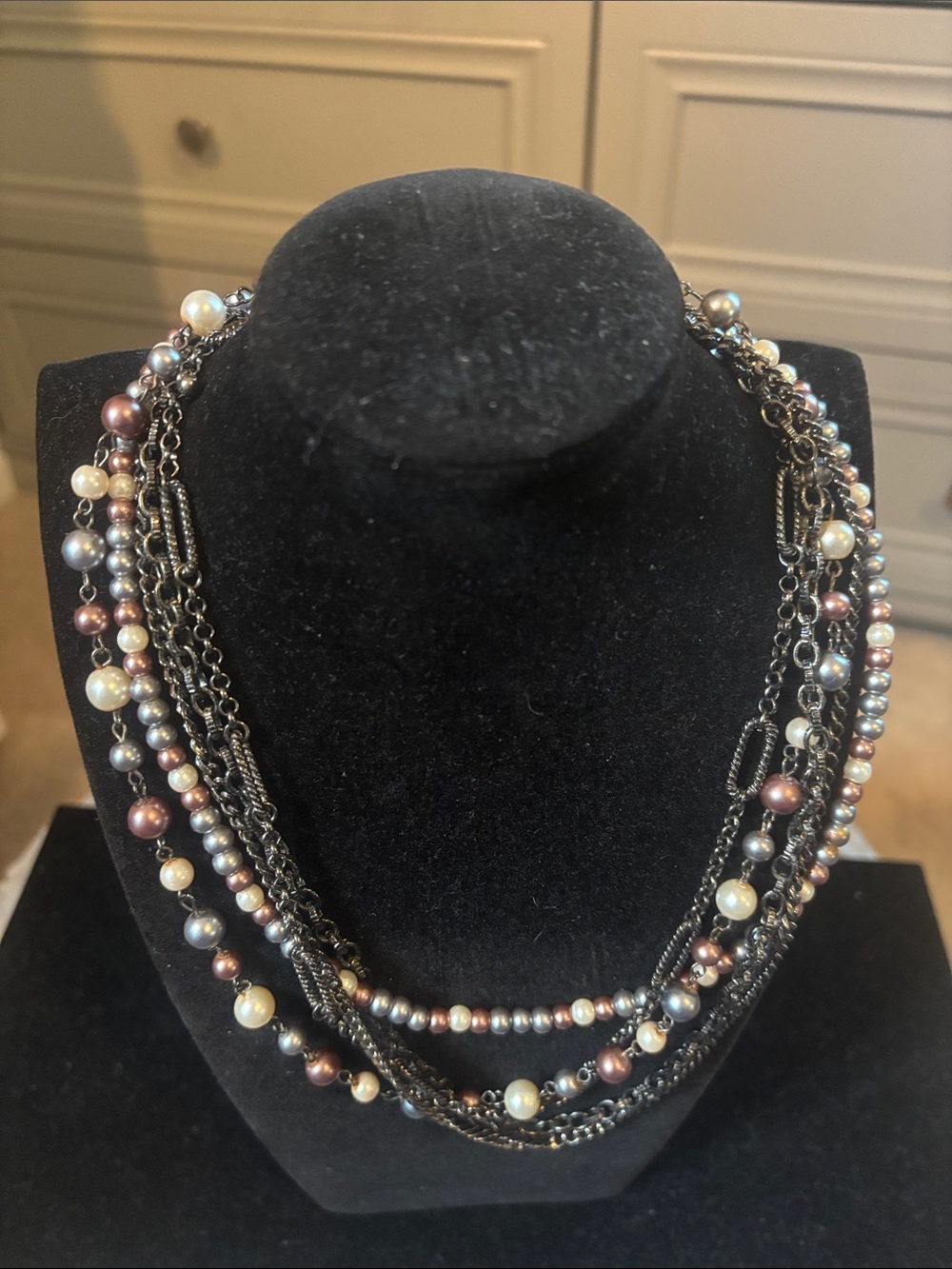 6 Strand necklace, 3 black chains and 2 multi color pearls in 2 sizes. Unique!